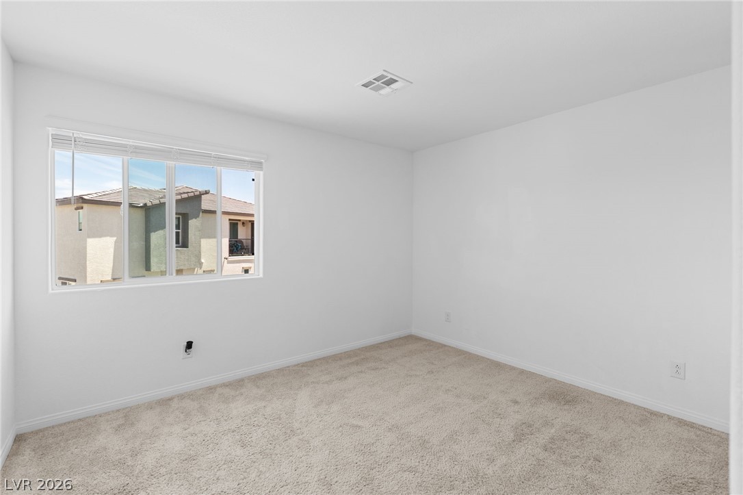 12367 Indigo Montage Road, Unit 3 Las Vegas, NV 89183 - Photo 22 of 33 Bright bedroom with a view and comfortable carpeting.