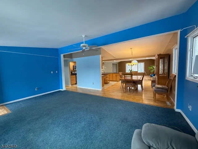 a view of livingroom with dining room and couches chair