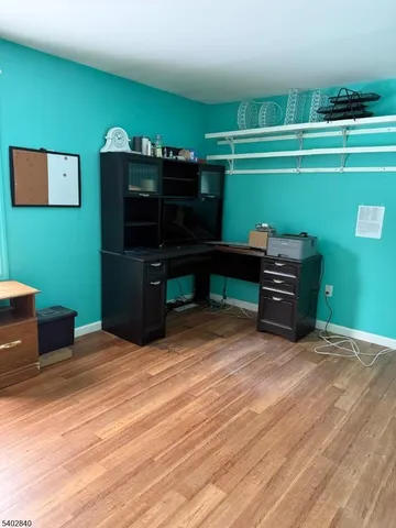 a room with furniture and a bookshelf