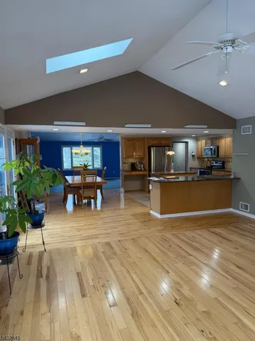 a view of a kitchen with furniture and a livingroom