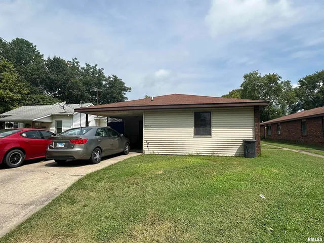 a view of a car in front of a house