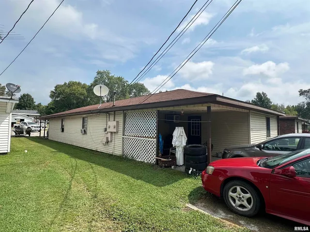 a car parked in front of a house