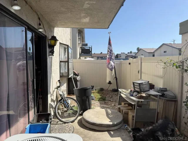 a kitchen with a refrigerator and a stove top oven