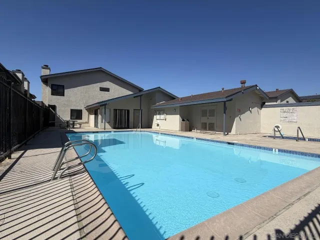 a front view of a house with swimming pool