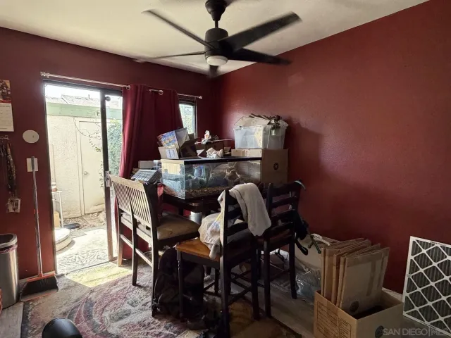 a dining room with furniture and window
