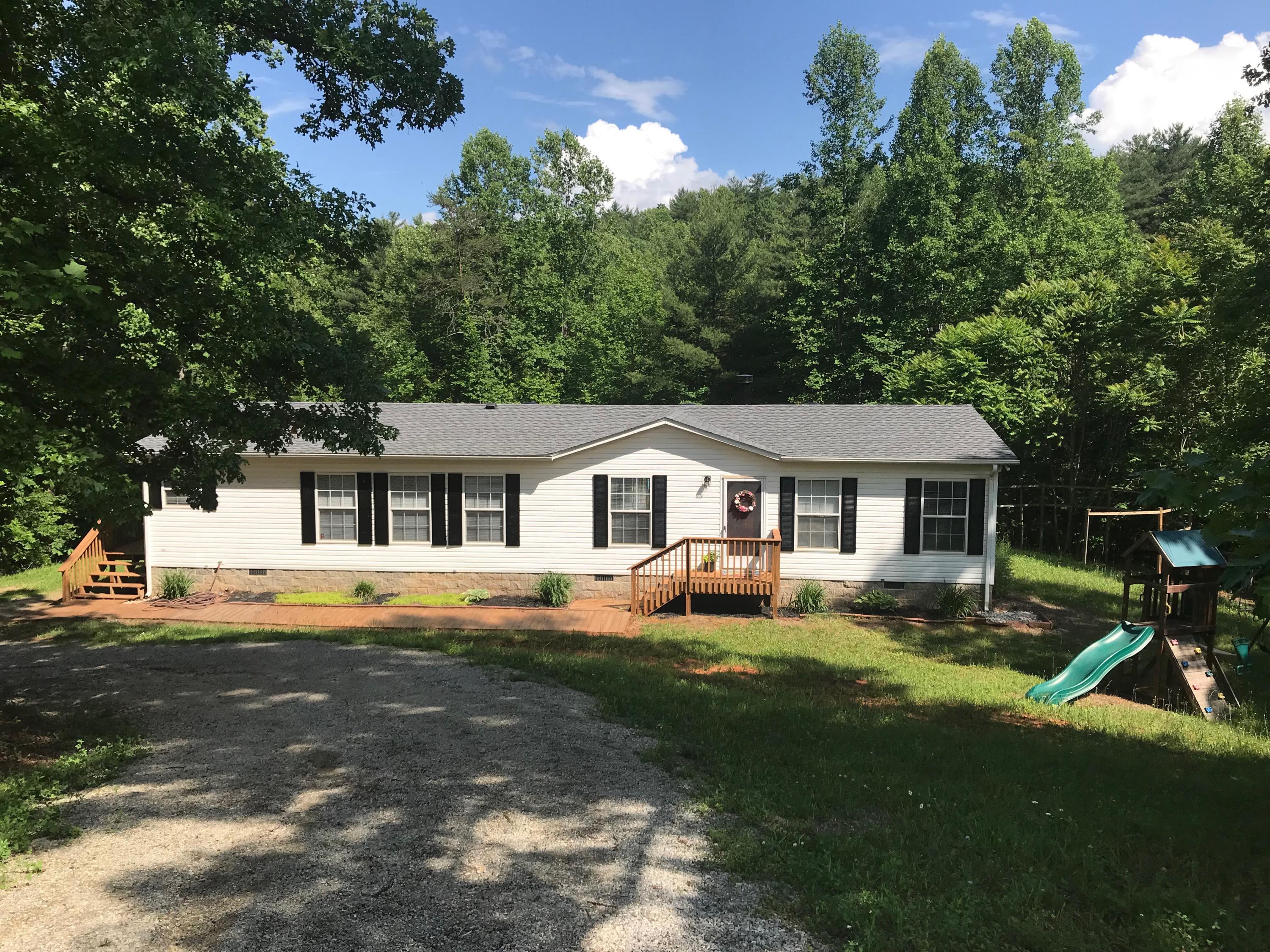 543 Isolane Road Callaway, VA 24067 - Photo 3 of 23 a view of a house with a big yard and large trees
