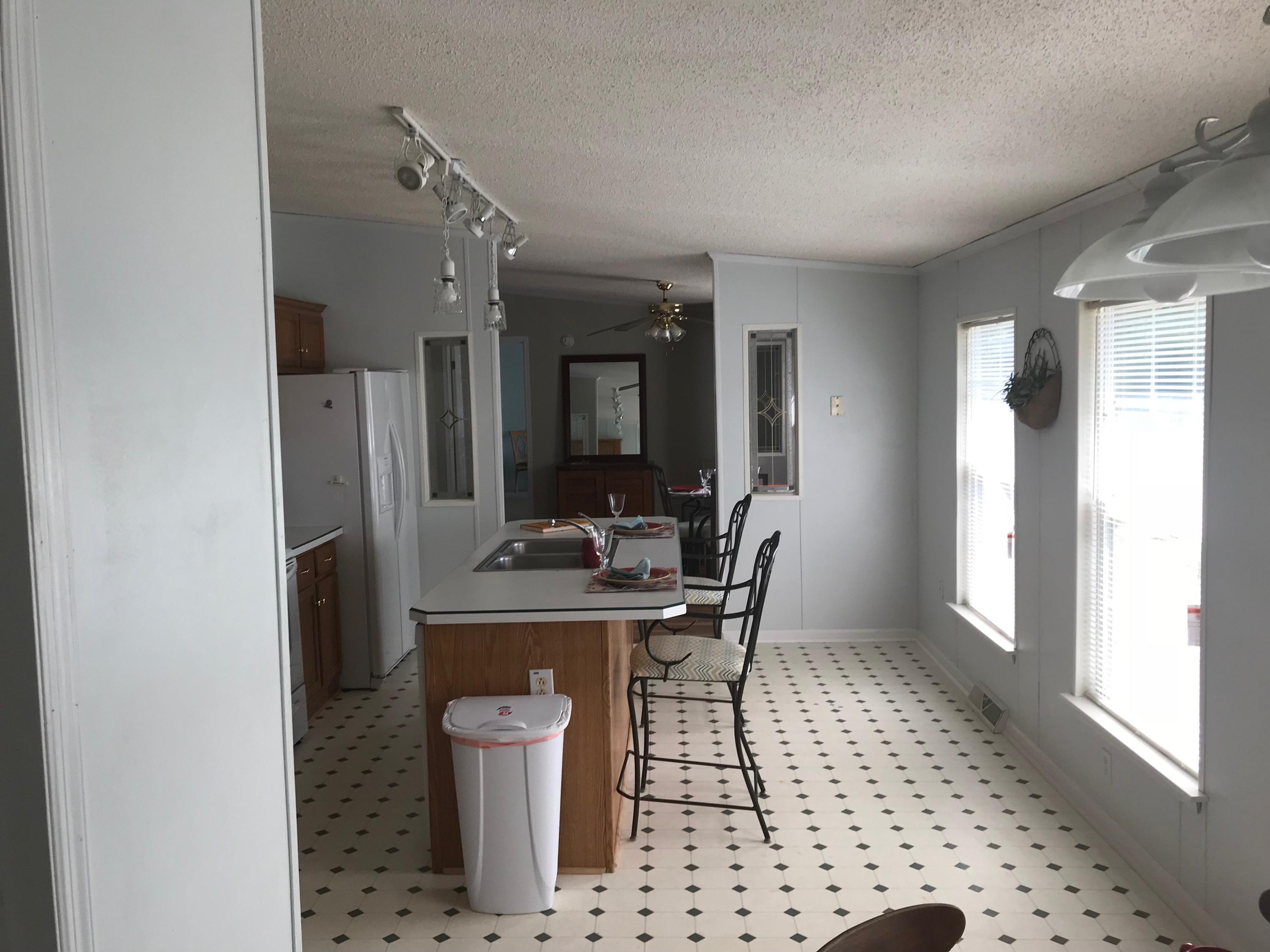 543 Isolane Road Callaway, VA 24067 - Photo 8 of 23 a view of a hallway with a dining table and chairs