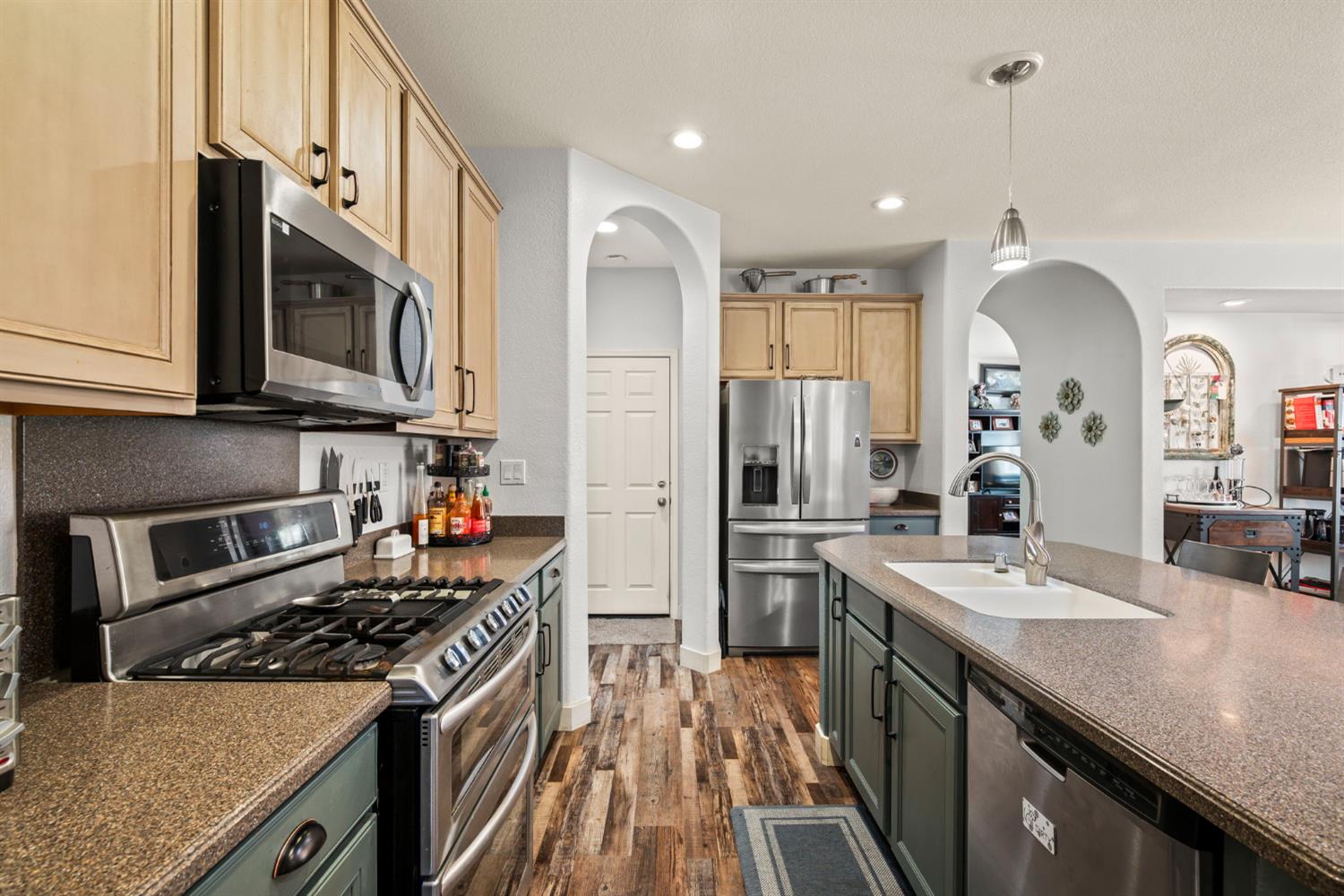 4403 Niobe Circle Rancho Cordova, CA 95742 - Photo 11 of 29 a kitchen with stainless steel appliances granite countertop a sink stove and refrigerator