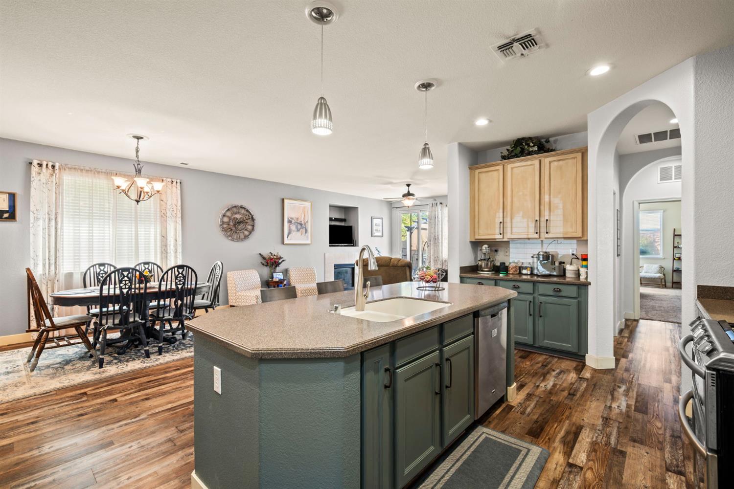 4403 Niobe Circle Rancho Cordova, CA 95742 - Photo 12 of 29 a kitchen with sink refrigerator and cabinets