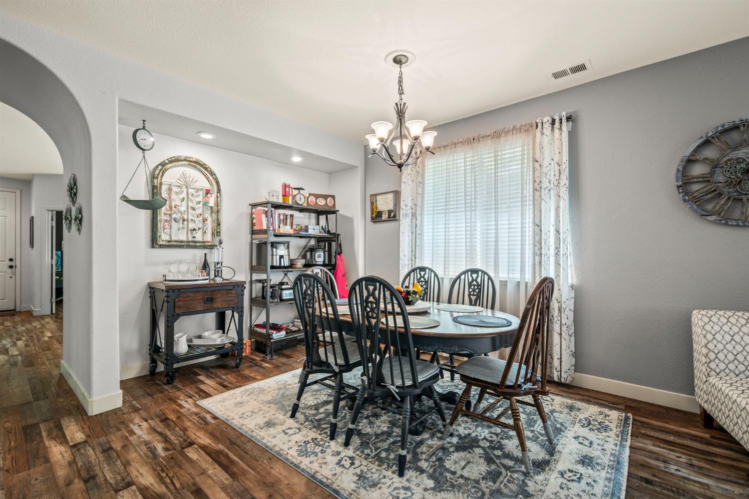 4403 Niobe Circle Rancho Cordova, CA 95742 - Photo 13 of 29 a view of a dining room with furniture window and wooden floor