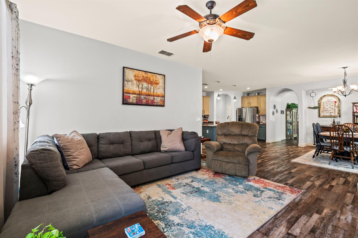 4403 Niobe Circle Rancho Cordova, CA 95742 - Photo 16 of 29 a living room with furniture and a rug
