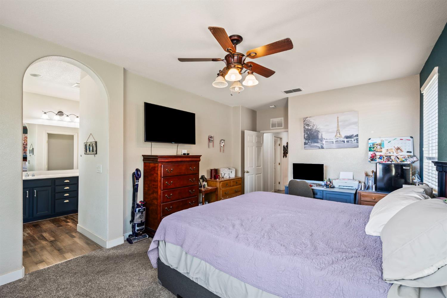 4403 Niobe Circle Rancho Cordova, CA 95742 - Photo 18 of 29 a bedroom with a bed and a flat screen tv