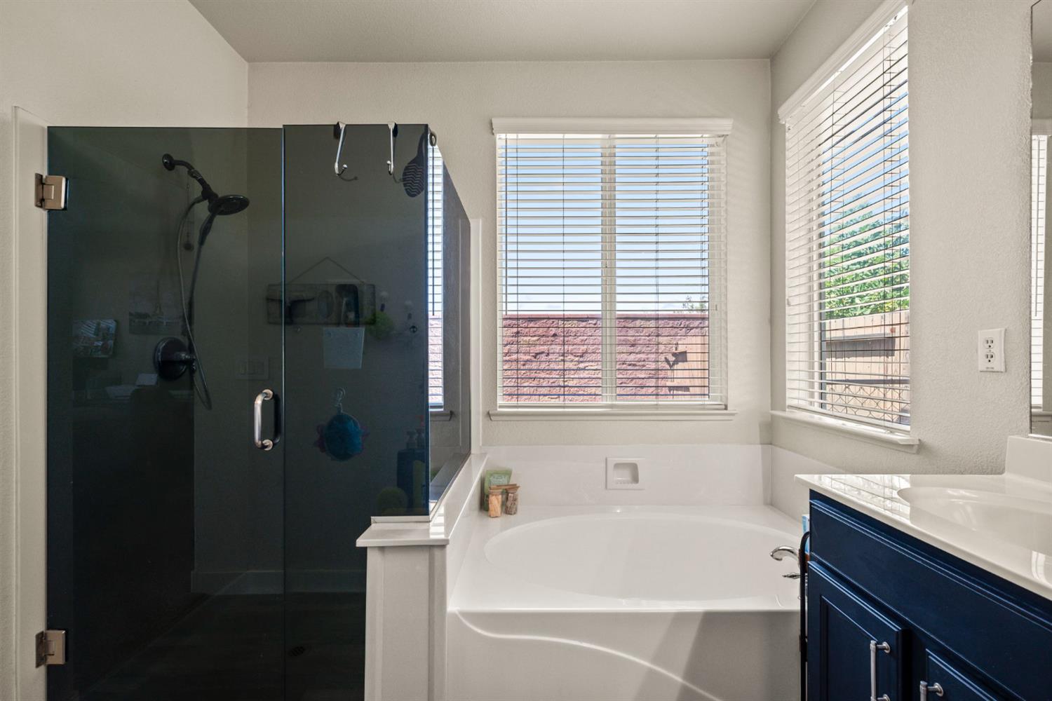 4403 Niobe Circle Rancho Cordova, CA 95742 - Photo 20 of 29 a bathroom with a bathtub and a shower
