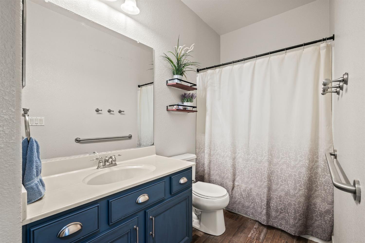 4403 Niobe Circle Rancho Cordova, CA 95742 - Photo 22 of 29 a bathroom with a granite countertop sink toilet and shower