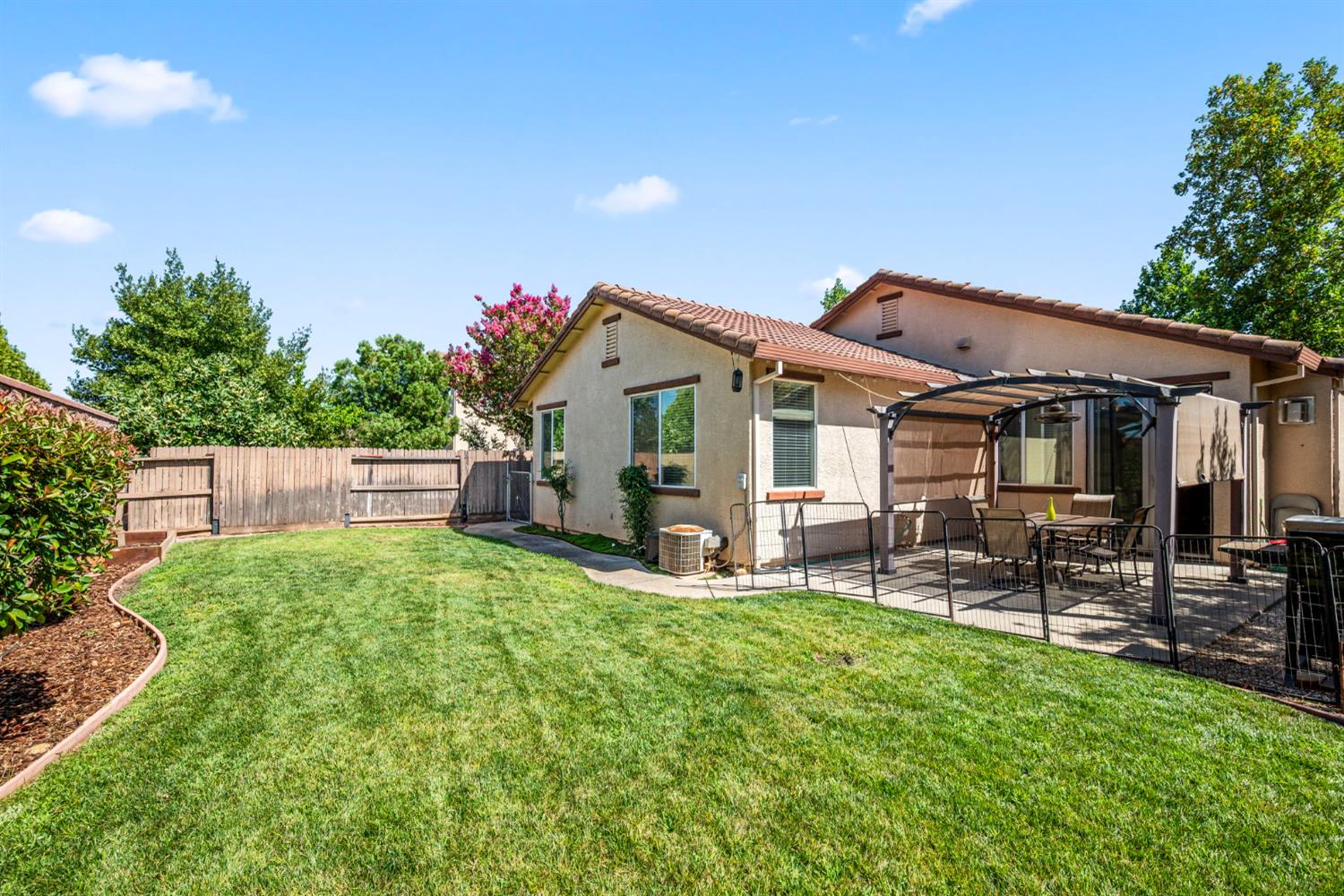 4403 Niobe Circle Rancho Cordova, CA 95742 - Photo 25 of 29 a view of a house with a yard and sitting area