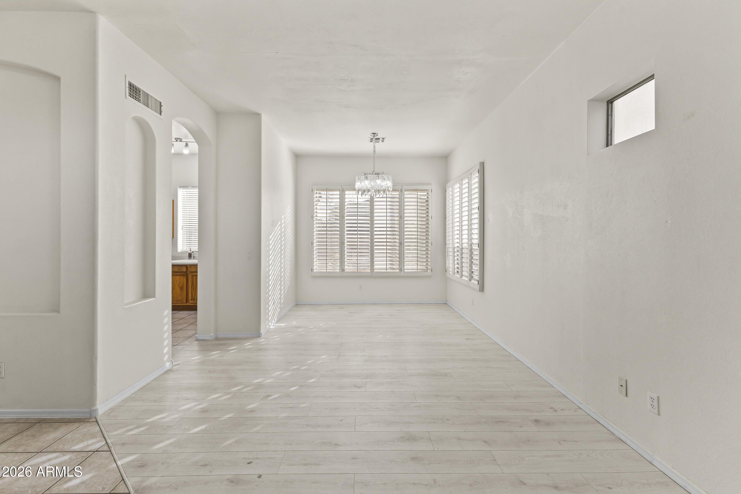 17639 North 17th Street Phoenix, AZ 85022 - Photo 10 of 42 a view of a hallway with wooden shelves