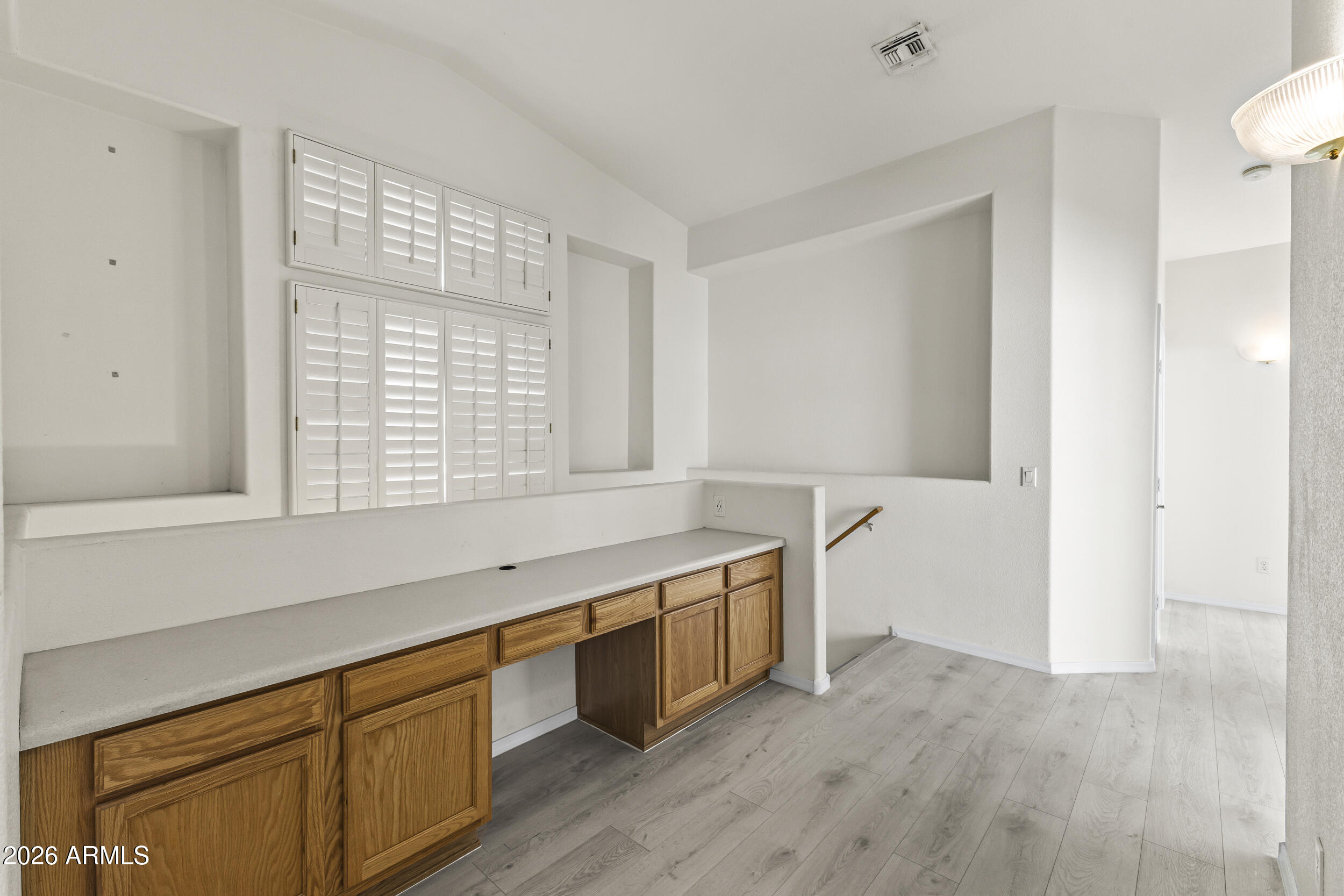 17639 North 17th Street Phoenix, AZ 85022 - Photo 20 of 42 a room with wooden cabinets and sink