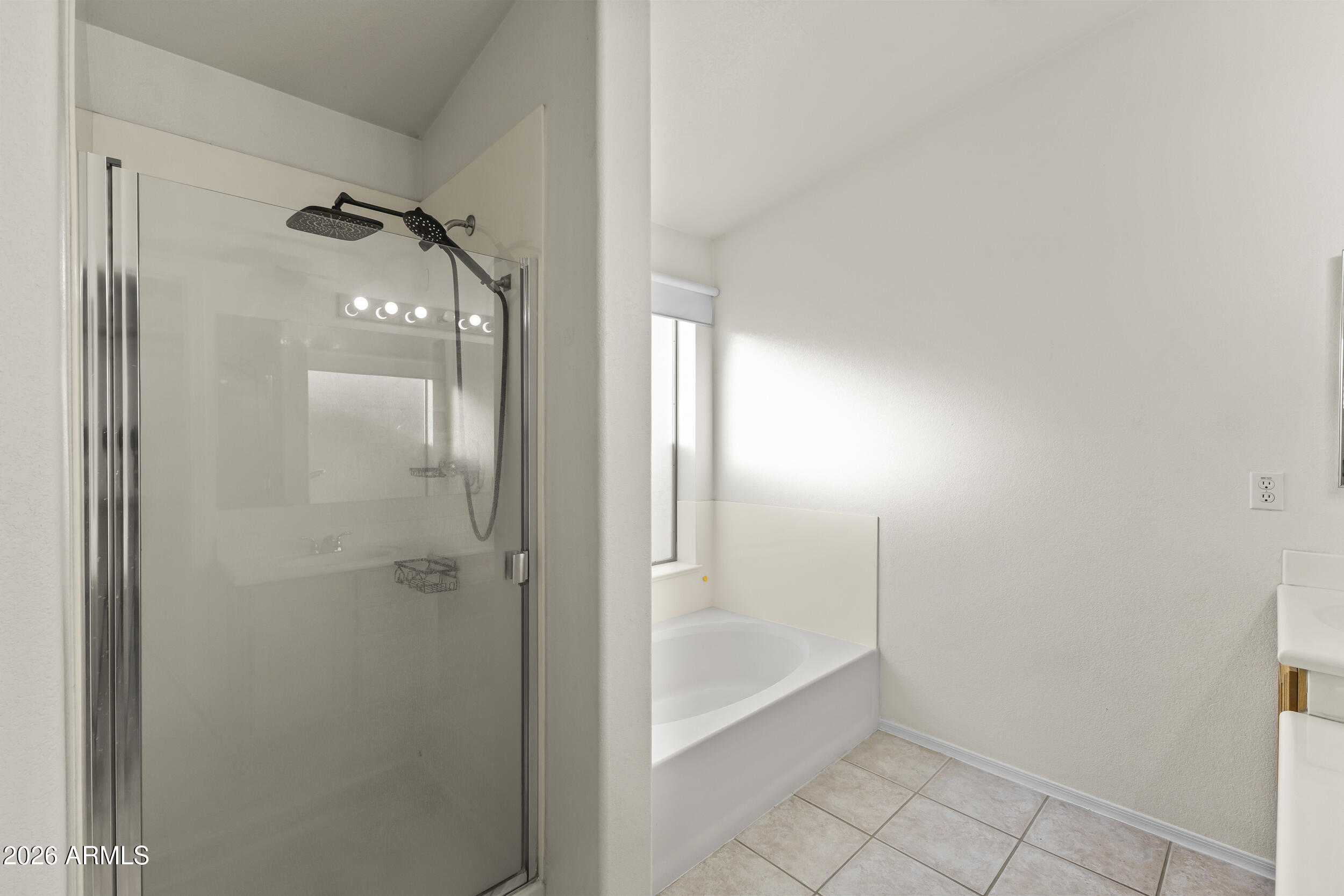 17639 North 17th Street Phoenix, AZ 85022 - Photo 27 of 42 a bathroom with a glass shower door