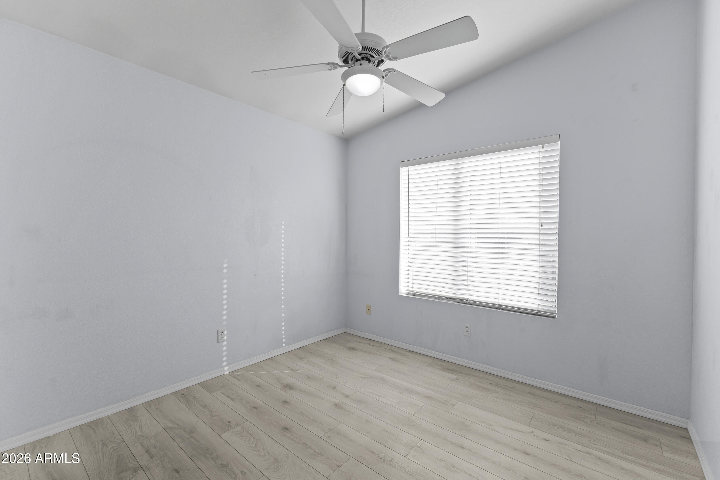 17639 North 17th Street Phoenix, AZ 85022 - Photo 32 of 42 an empty room with a window and a fan