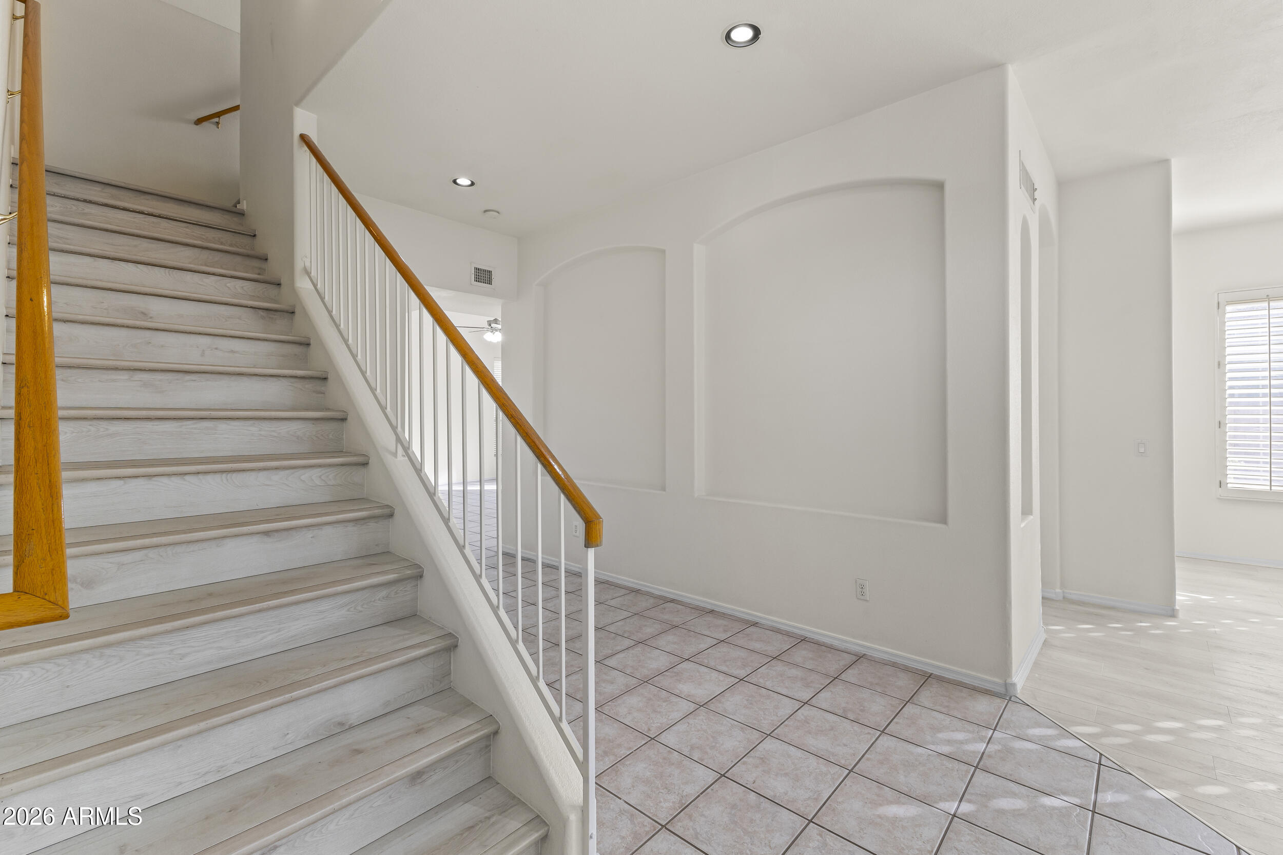 17639 North 17th Street Phoenix, AZ 85022 - Photo 7 of 42 a view of entryway and hall with wooden floor