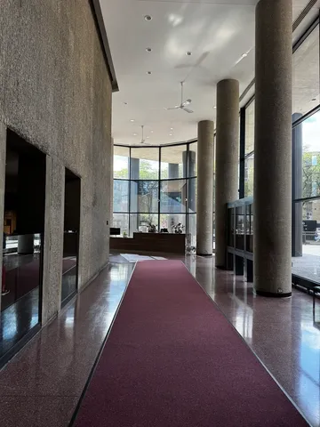 a view of a lobby with black carpet