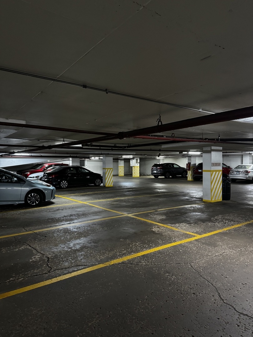 5415 North Sheridan Road, Unit 5414 Chicago, IL 60640 - Photo 18 of 18 a view of parking garage with cars
