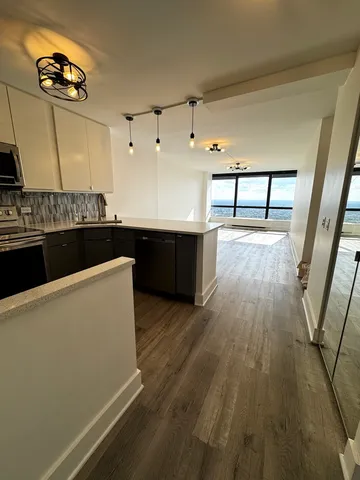 a view of cabinets and wooden floor