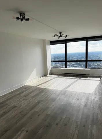 a view of an empty room with a window