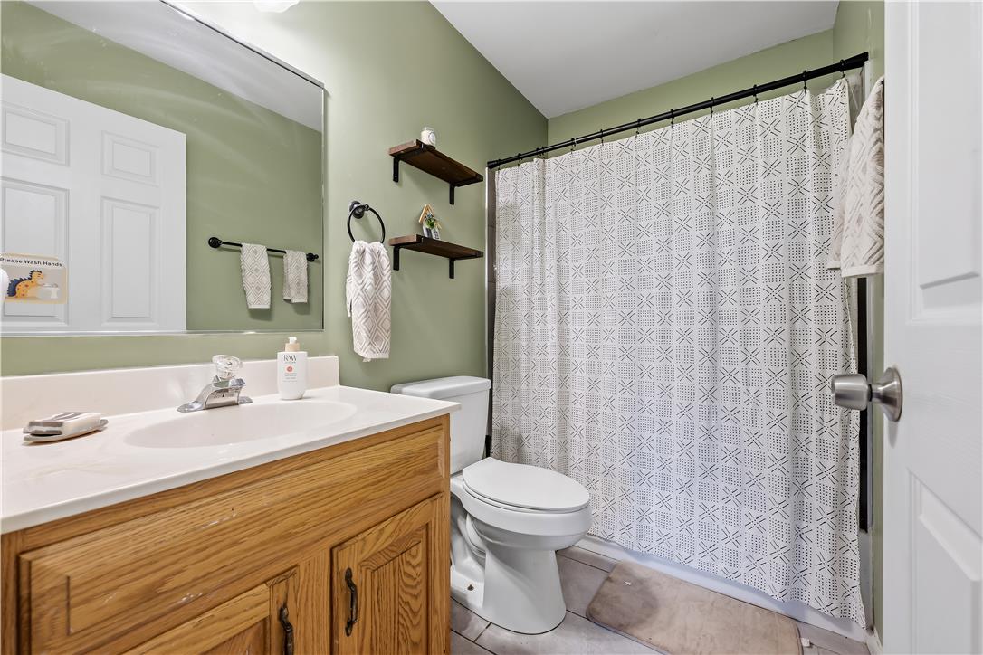9868 Stagecoach Road Kempton, PA 19529 - Photo 12 of 17 Functional full bathroom featuring a vanity with ample storage and a complete shower/tub combination.