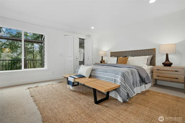 a bedroom with a bed and window