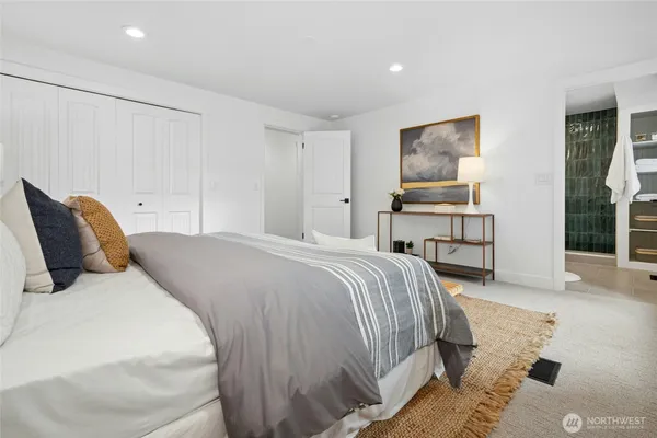a bedroom with a bed and a desk