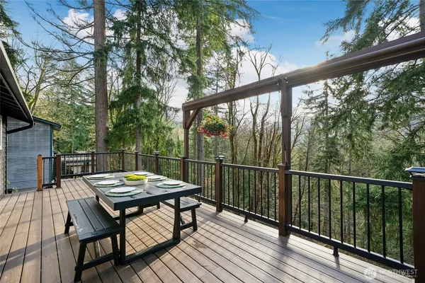 a view of a balcony with mountain view and wooden floor