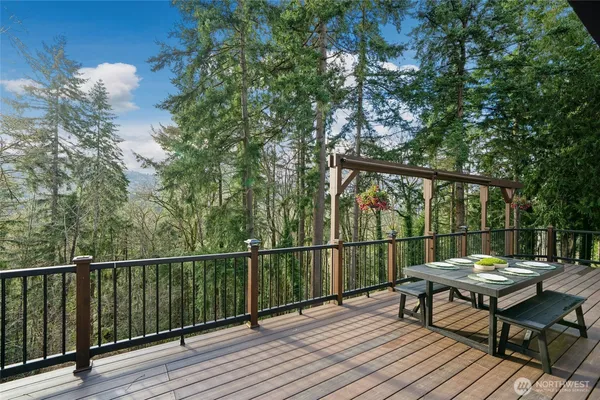 a view of a roof deck with wooden floor and outdoor seating