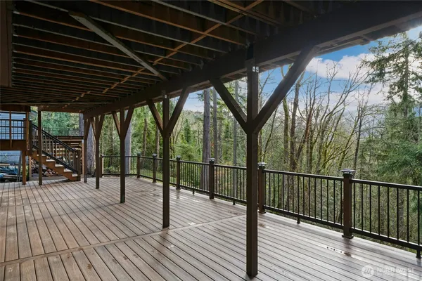 a view of a balcony with wooden floor