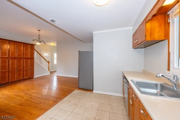 a kitchen that has a sink and a stove in it