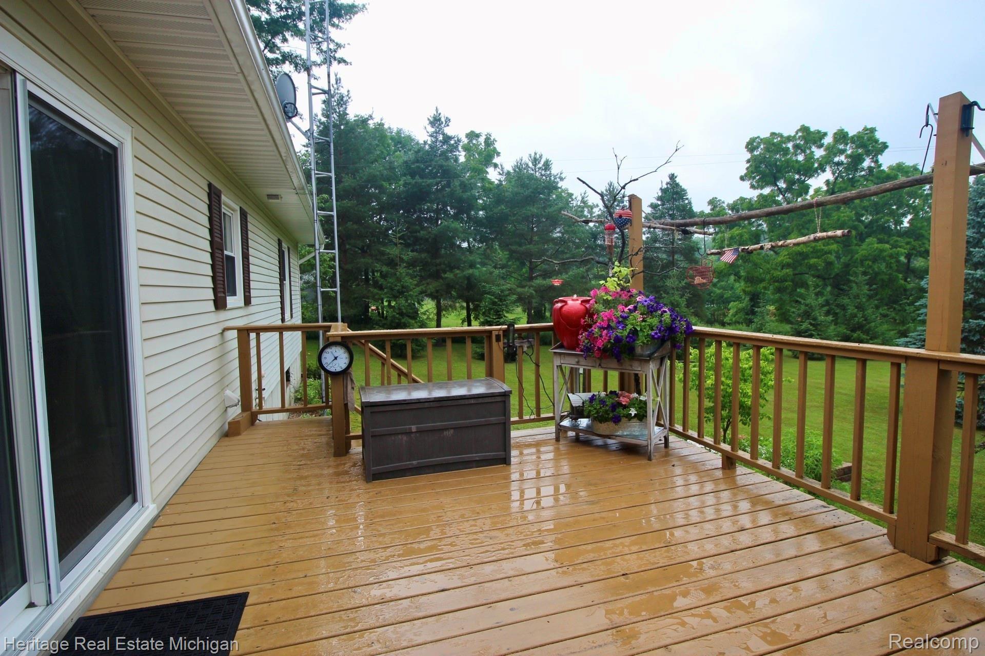 7489 Lehring Road Bancroft, MI 48414 - Photo 29 of 55 Back deck leading to dining room