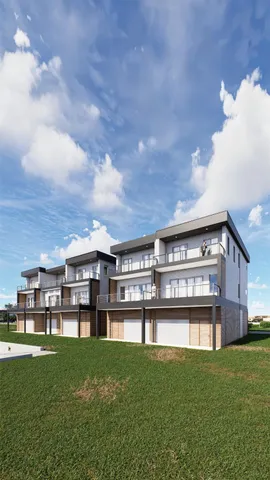 a view of a big yard and large buildings