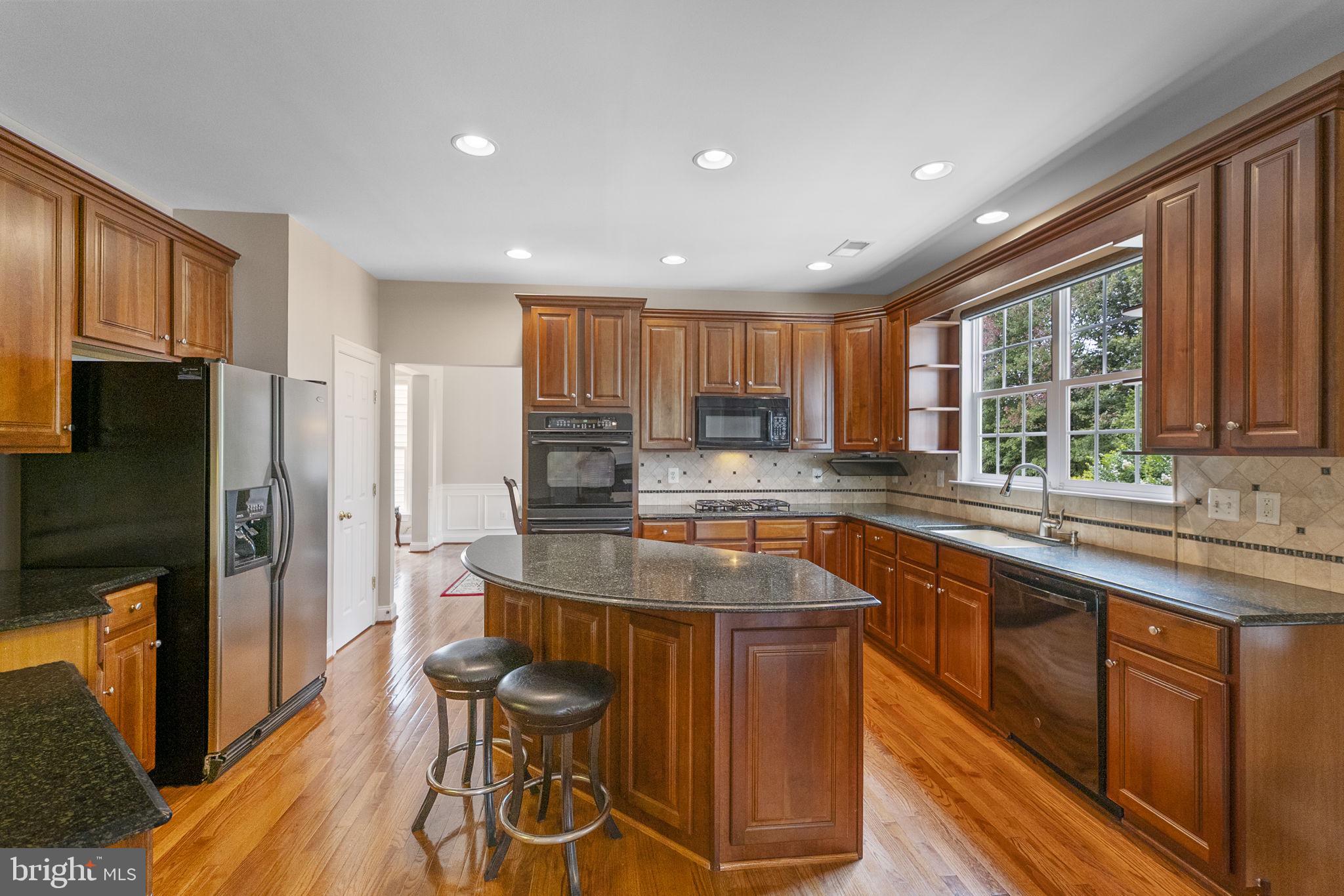 23128 Persimmon Ridge Road Clarksburg, MD 20871 - Photo 2 of 66 Enjoy meal prep in the gourmet kitchen
