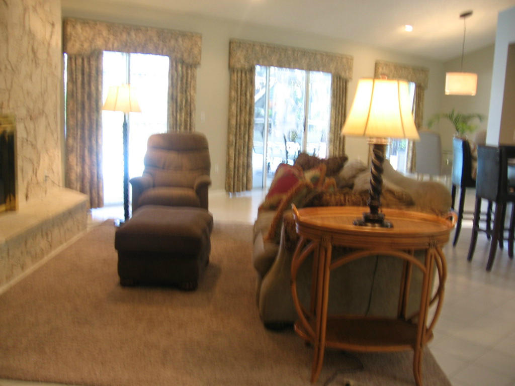 245 Northwest 70th Street Boca Raton, FL 33487 - Photo 14 of 39 a living room with furniture and a large window