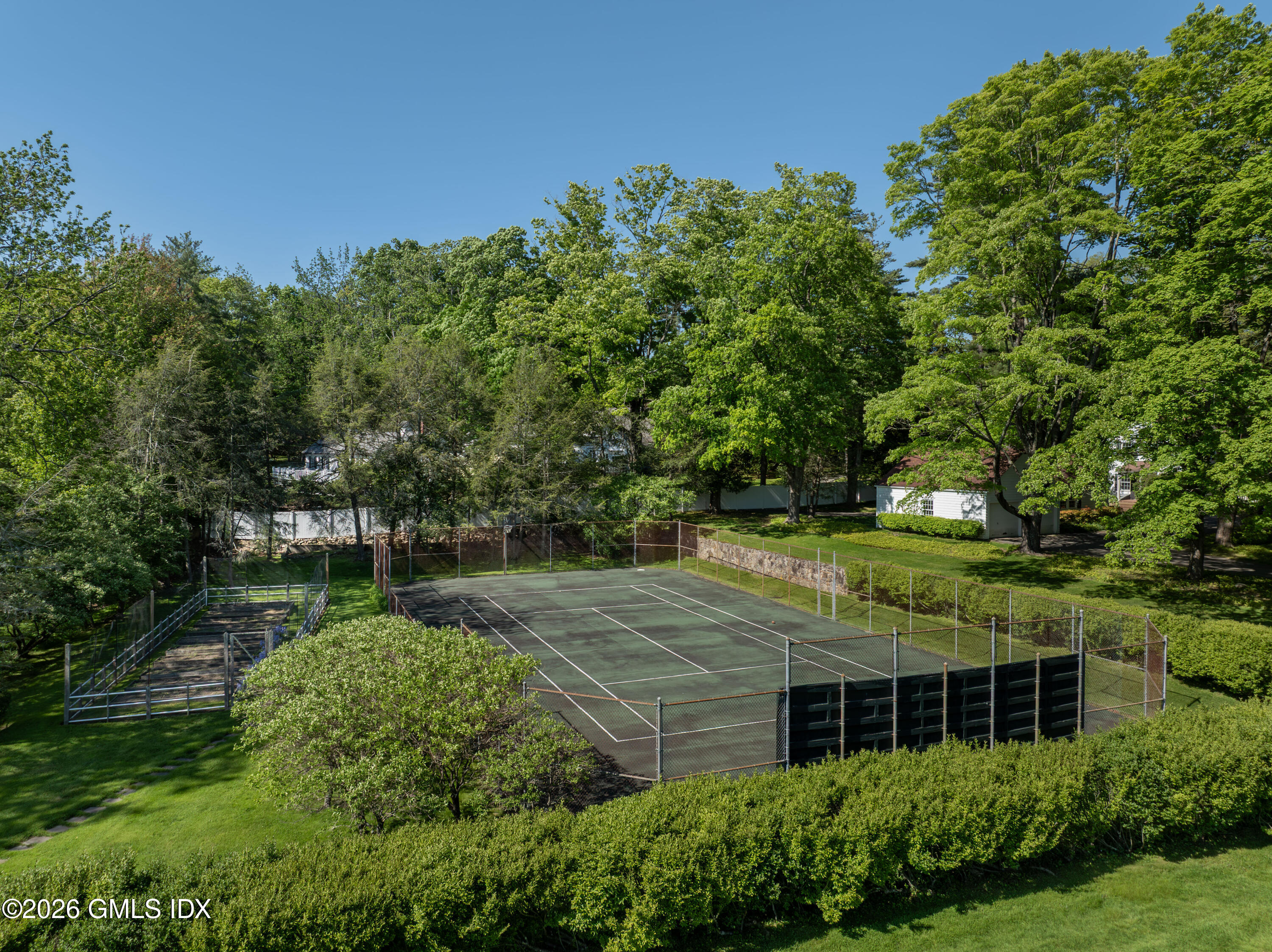 122 Round Hill Road Greenwich, CT 06831 - Photo 20 of 37 a view of house with a yard