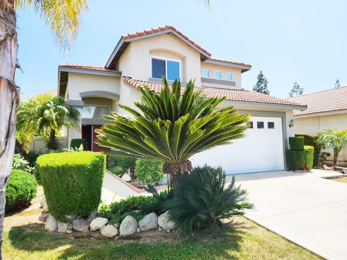948 Bingham Drive Corona, CA 92882 - Photo 1 of 14 a front view of a house with a yard