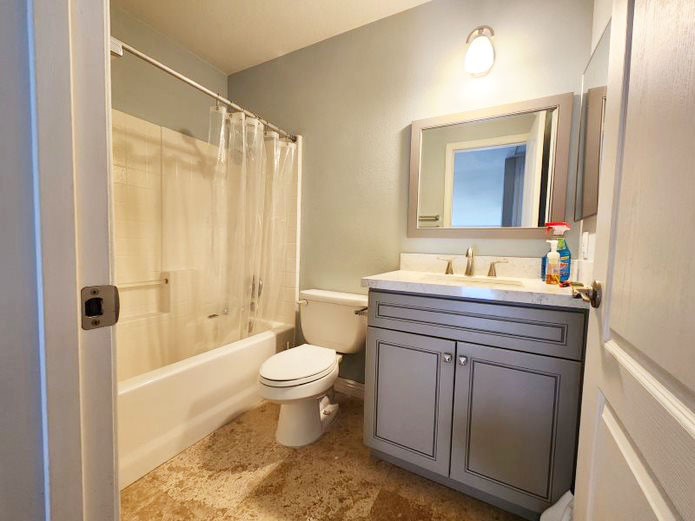948 Bingham Drive Corona, CA 92882 - Photo 9 of 14 a bathroom with a sink toilet a mirror and shower