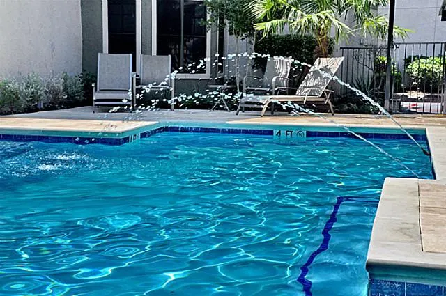 a view of a house with backyard porch and sitting area