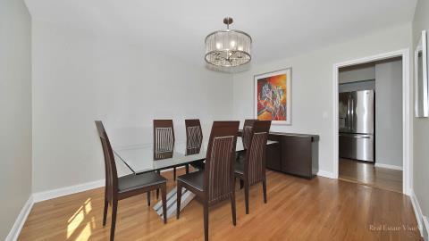 1248 Hackberry Road Deerfield, IL 60015 - Photo 11 of 40 a view of a dining room with furniture and wooden floor