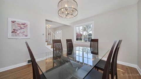 1248 Hackberry Road Deerfield, IL 60015 - Photo 12 of 40 a view of a dining room with furniture window and wooden floor
