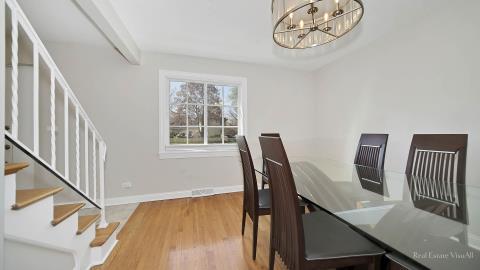 1248 Hackberry Road Deerfield, IL 60015 - Photo 13 of 40 a view of a dining room with furniture window and wooden floor