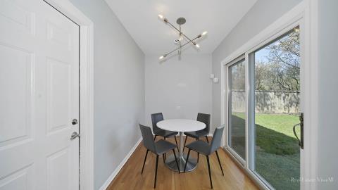 1248 Hackberry Road Deerfield, IL 60015 - Photo 18 of 40 a view of a dining room with furniture and wooden floor