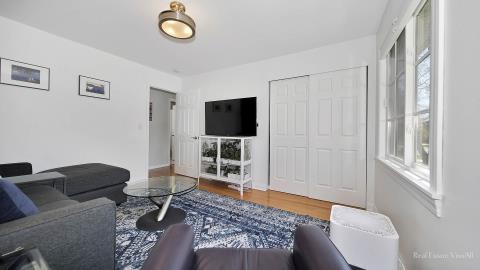 1248 Hackberry Road Deerfield, IL 60015 - Photo 29 of 40 a living room with furniture and a flat screen tv