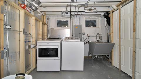 1248 Hackberry Road Deerfield, IL 60015 - Photo 37 of 40 a view of a hallway with washer and dryer