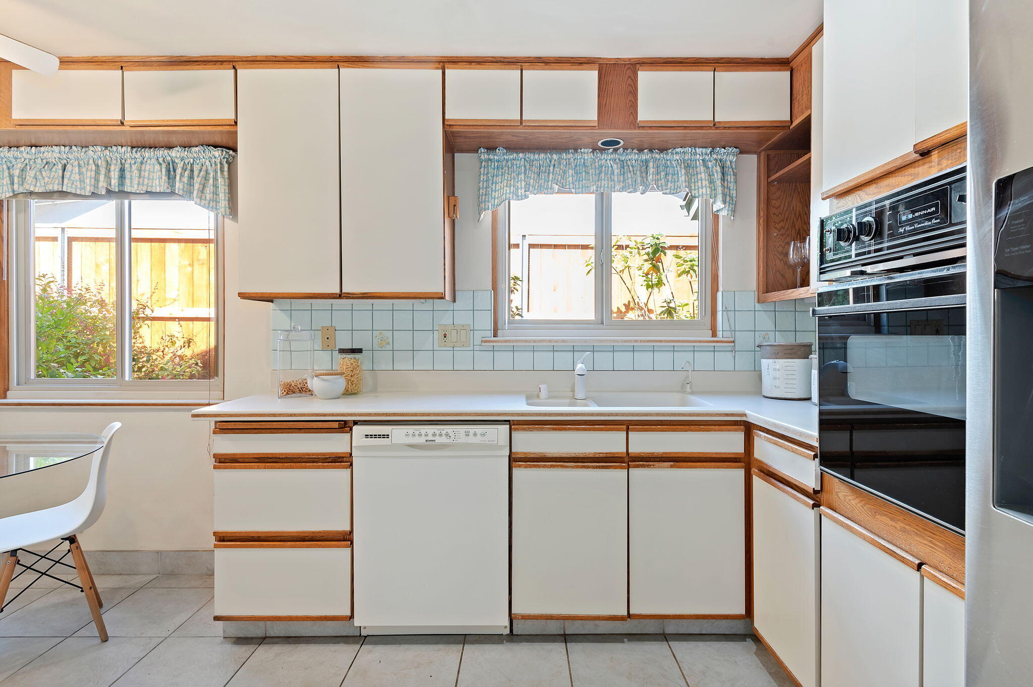 7397 Mirano Drive Goleta, CA 93117 - Photo 12 of 27 a kitchen with a sink cabinets and window